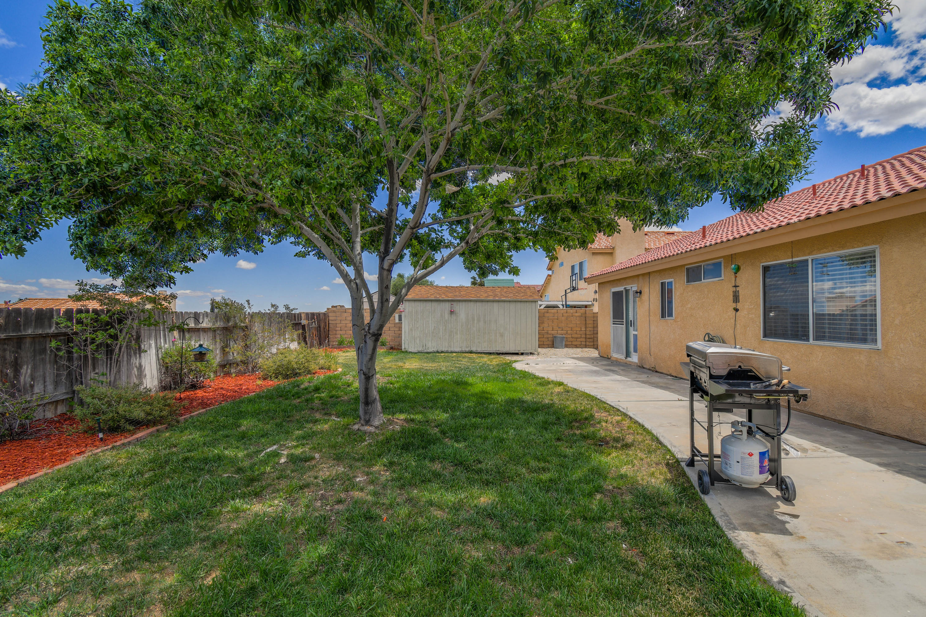 3129 Quarry Road Palmdale, CA 93550 - Photo 16 of 19 a backyard of a house with seating space