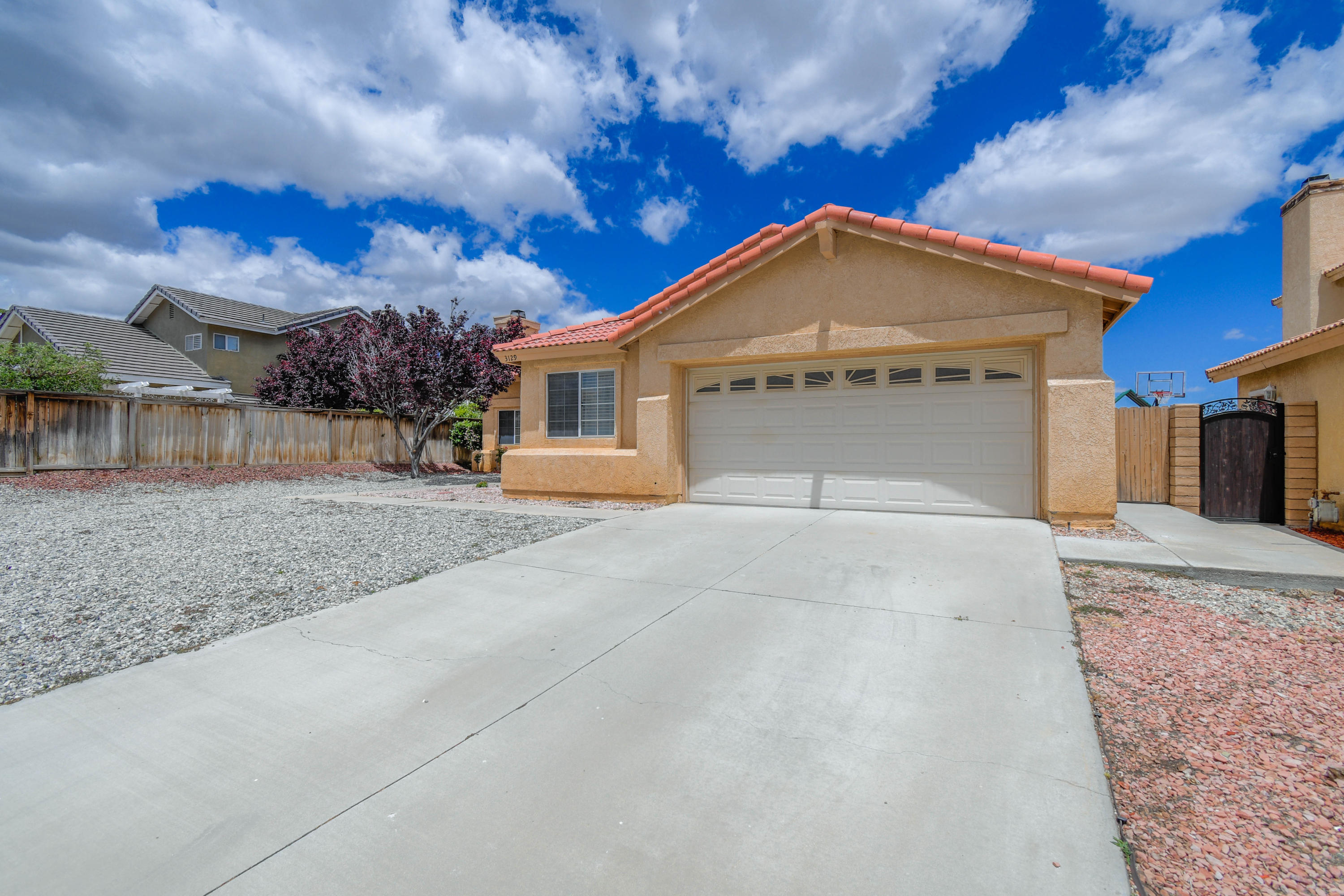 3129 Quarry Road Palmdale, CA 93550 - Photo 3 of 19 a view of a house with a yard