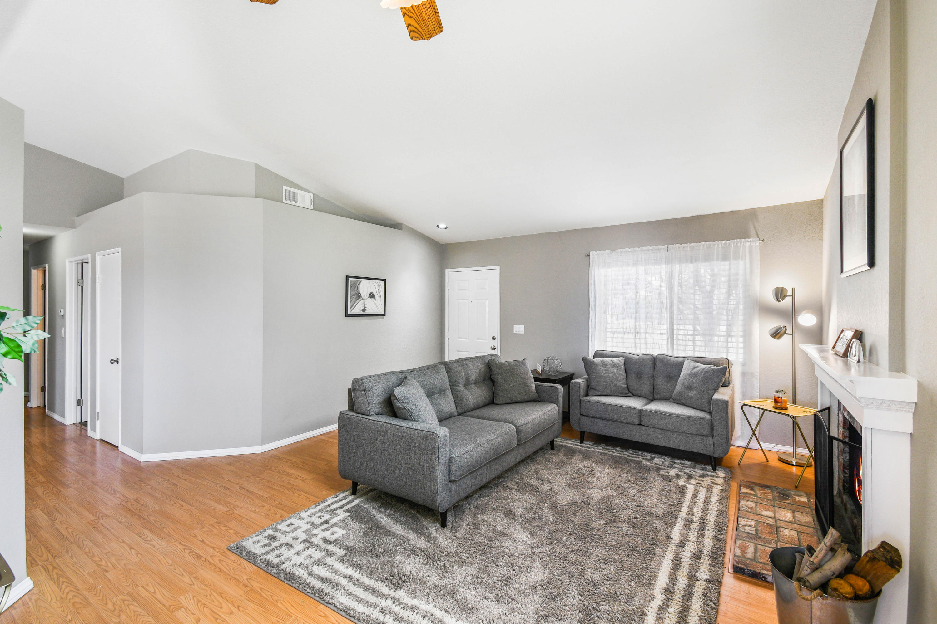 3129 Quarry Road Palmdale, CA 93550 - Photo 5 of 19 a living room with furniture and a flat screen tv