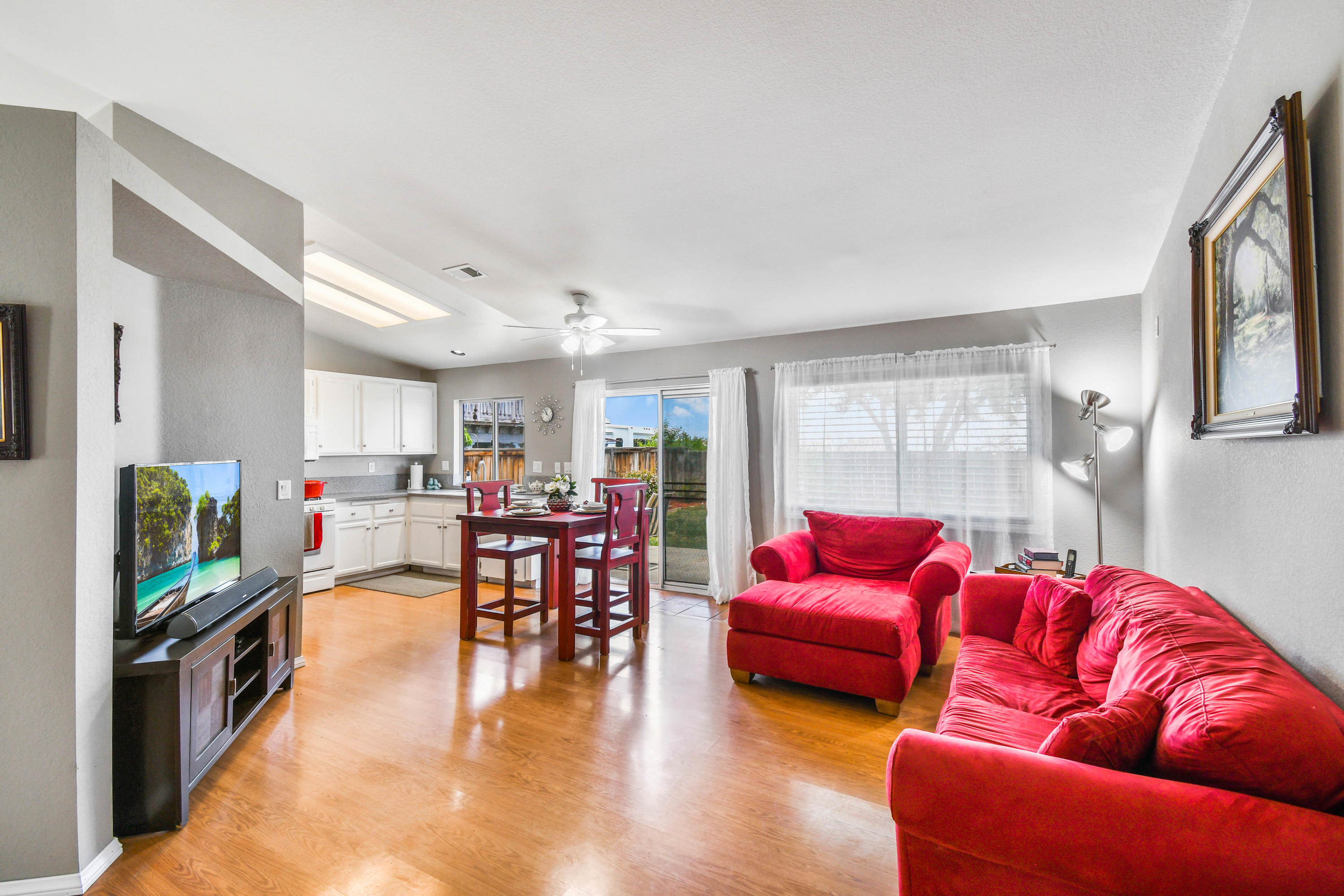 3129 Quarry Road Palmdale, CA 93550 - Photo 6 of 19 a living room with furniture kitchen view and a large window