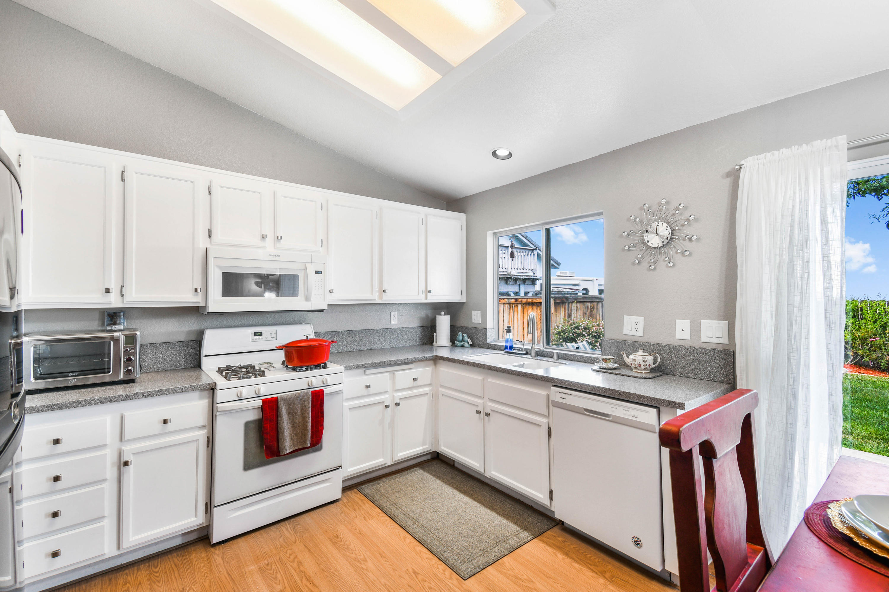3129 Quarry Road Palmdale, CA 93550 - Photo 7 of 19 a kitchen with white cabinets sink and white appliances