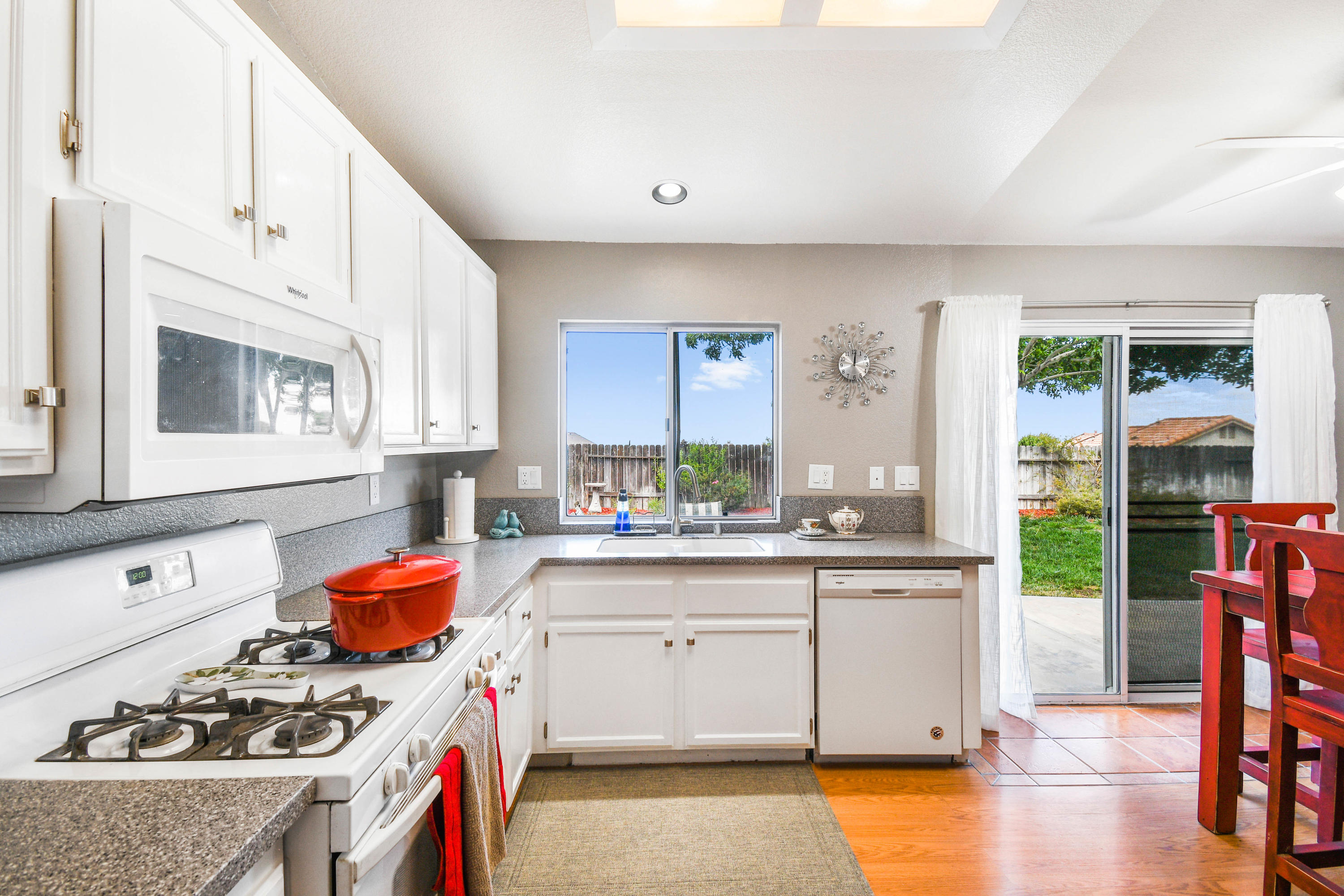 3129 Quarry Road Palmdale, CA 93550 - Photo 8 of 19 a kitchen with a sink stove and cabinets