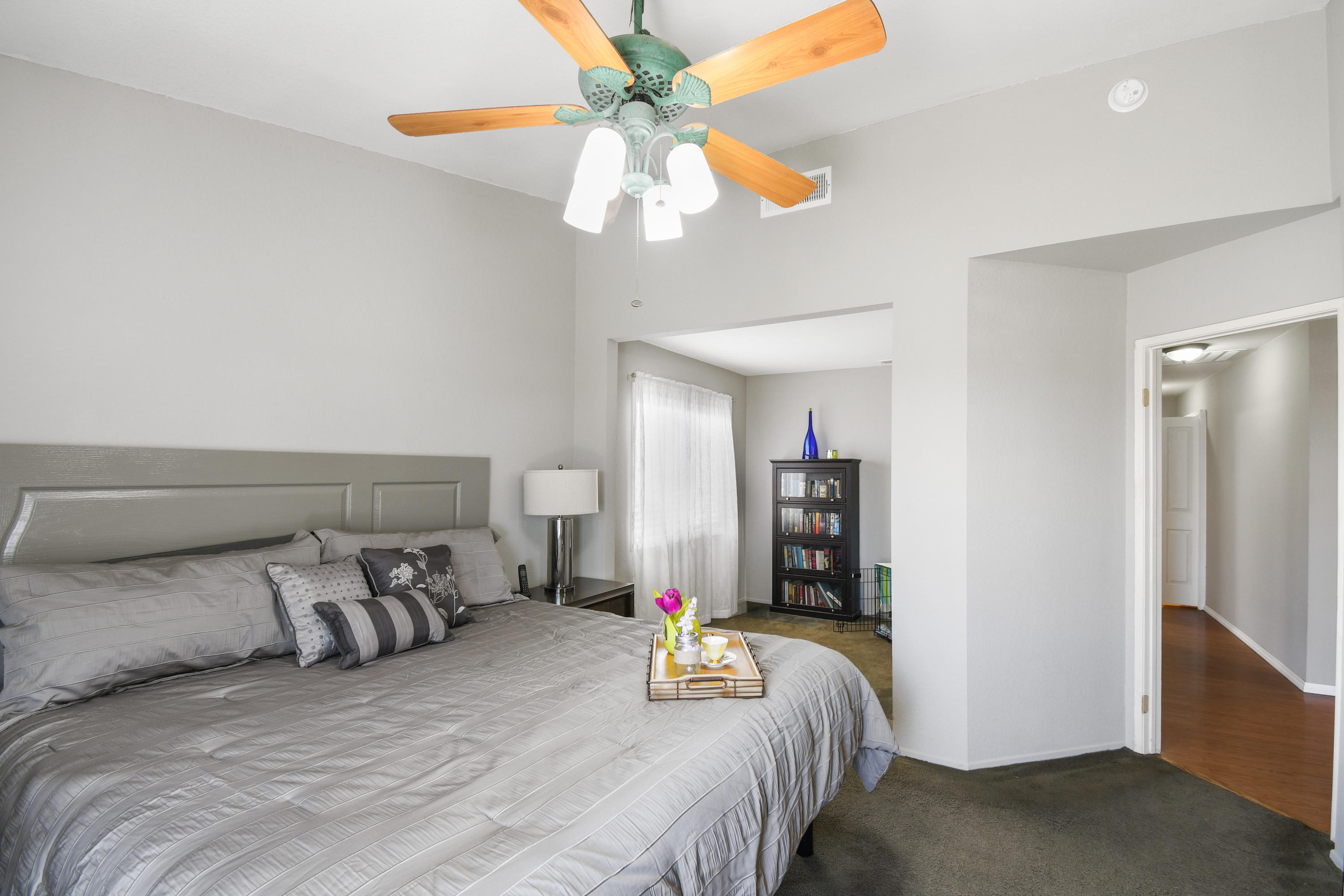 3129 Quarry Road Palmdale, CA 93550 - Photo 10 of 19 a bedroom with bed and a chandelier