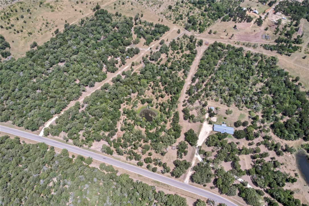 5 - Hog Eye Rd Manor Manor, TX 78653 - Photo 11 of 34 a view of a green field with lots of bushes