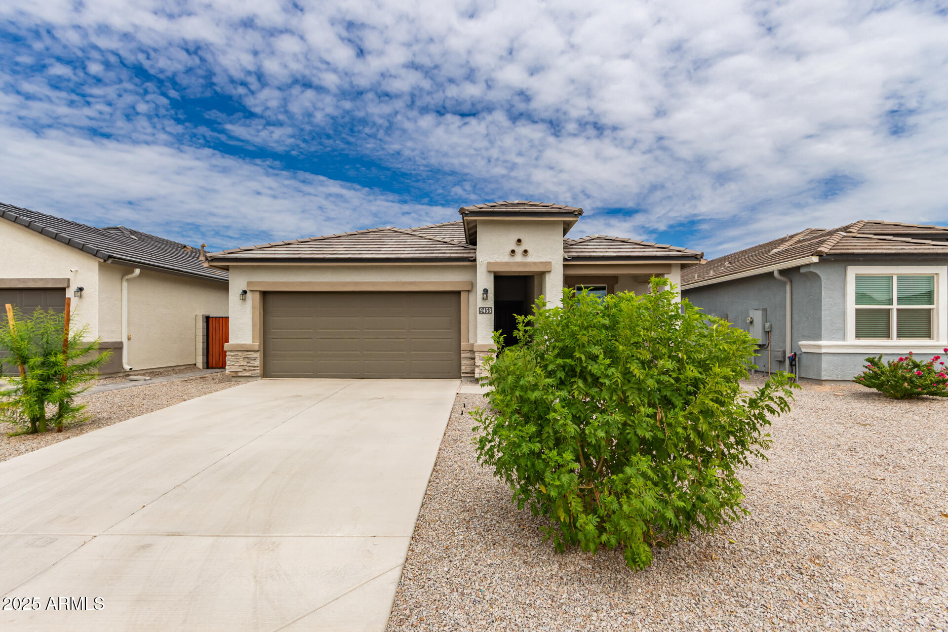 front view of a house with a yard