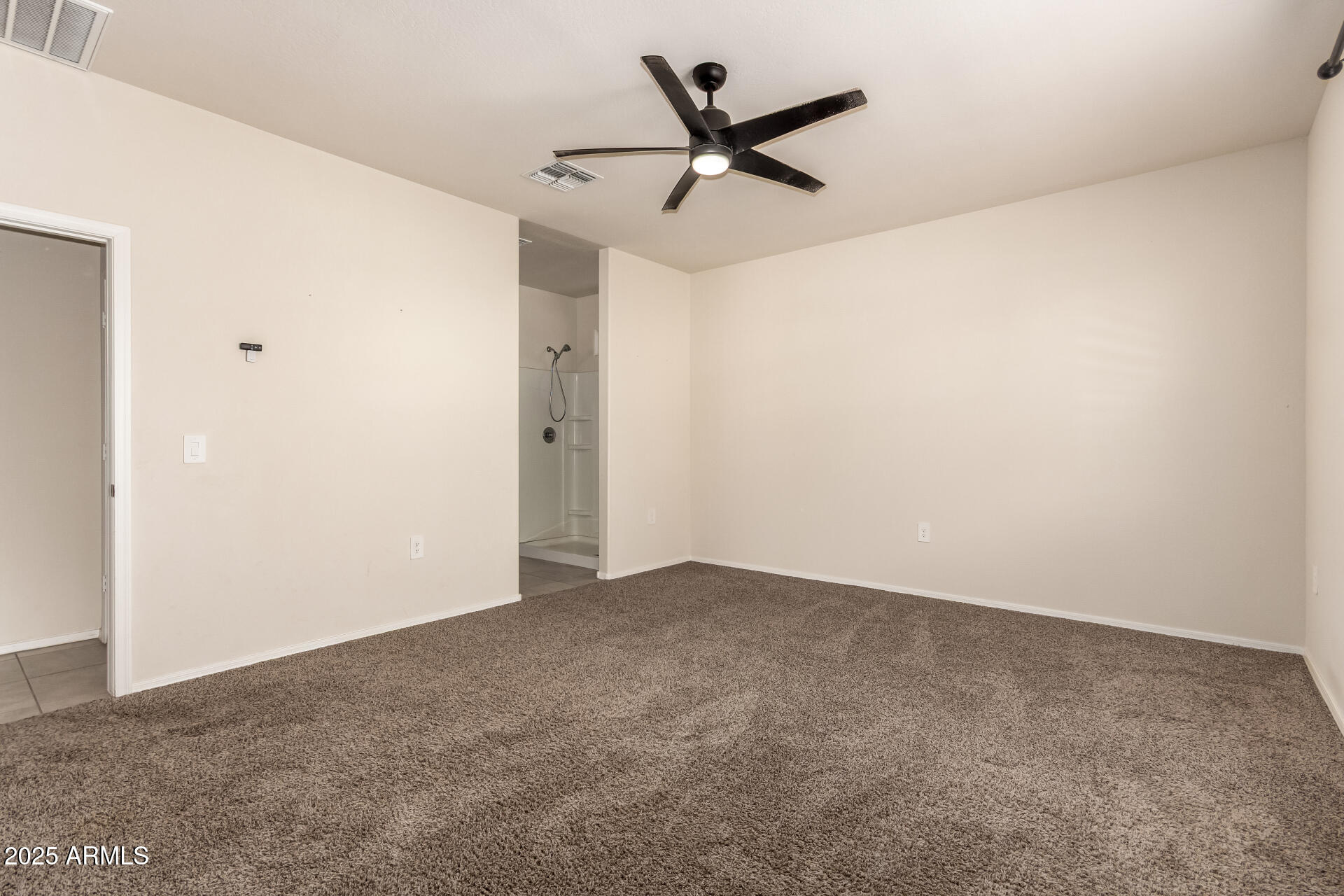9458 Cotton Road Florence, AZ 85132 - Photo 14 of 30 a view of a big room with carpet