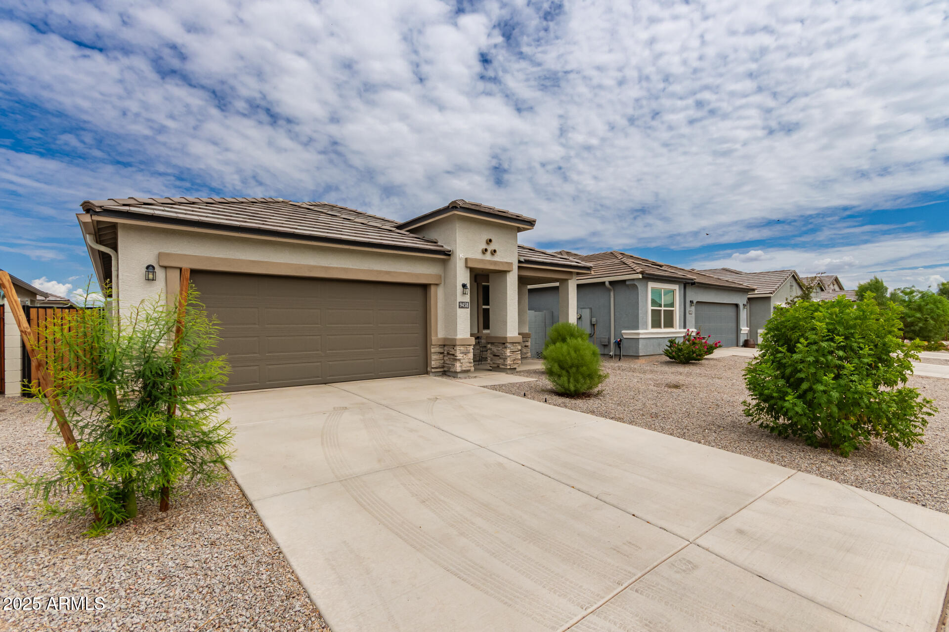 9458 Cotton Road Florence, AZ 85132 - Photo 2 of 30 a front view of a house with garden