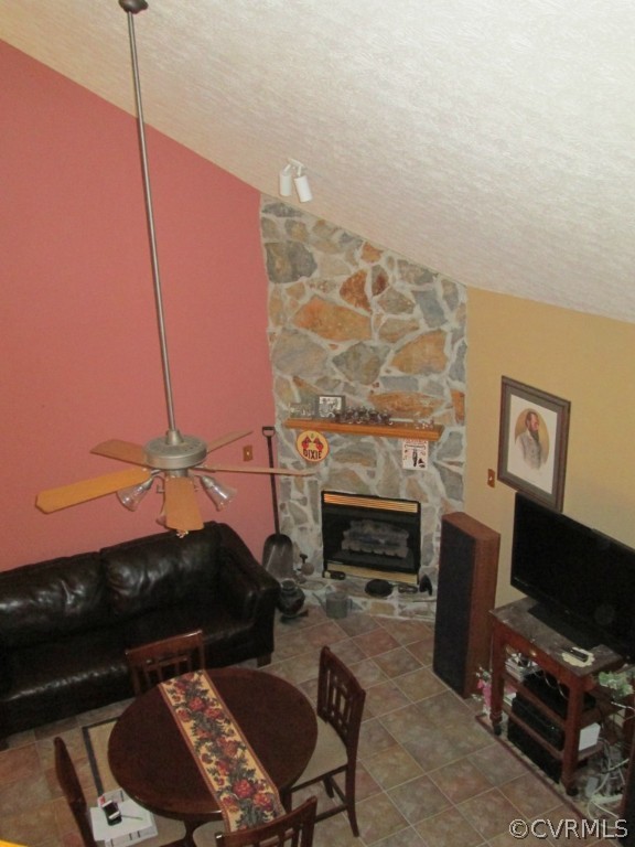 17755 Loving Union Road Disputanta, VA 23842 - Photo 2 of 20 a living room with furniture a fireplace and a flat screen tv