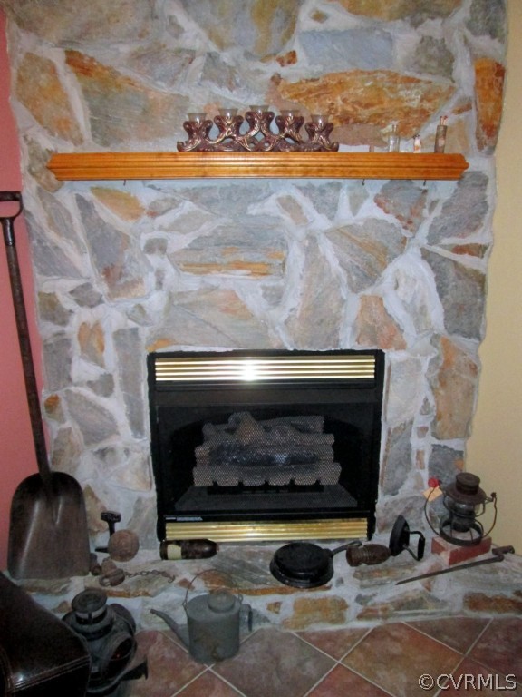 17755 Loving Union Road Disputanta, VA 23842 - Photo 3 of 20 a living room with a fireplace and a wooden floor