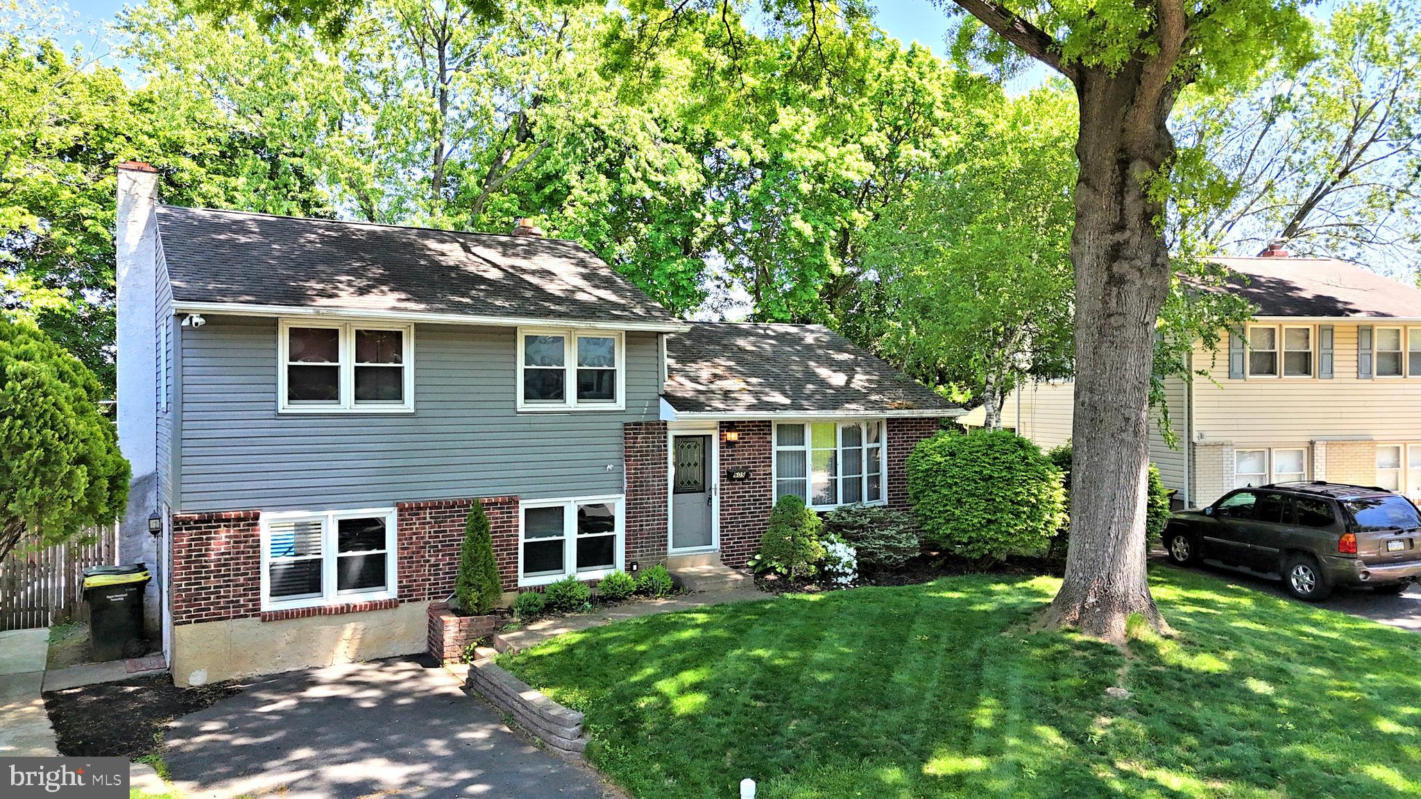 609 Mansfield Road Willow Grove, PA 19090 - Photo 54 of 68 a front view of a house with a garden