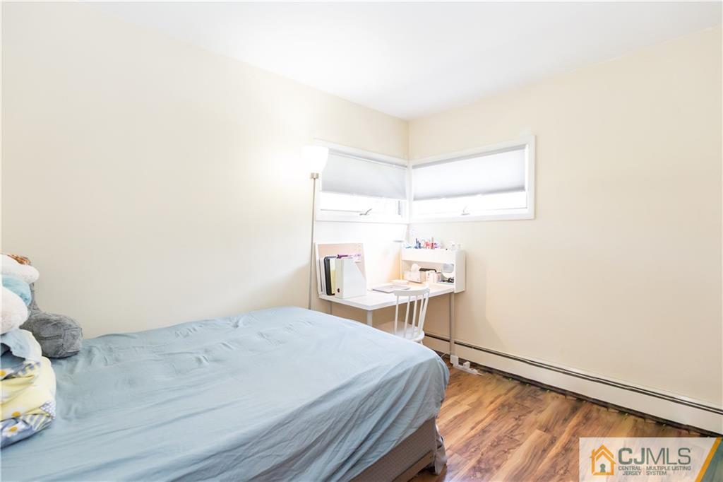 5 Mercury Road Edison, NJ 08817 - Photo 13 of 29 a bedroom with a bed and a table in it
