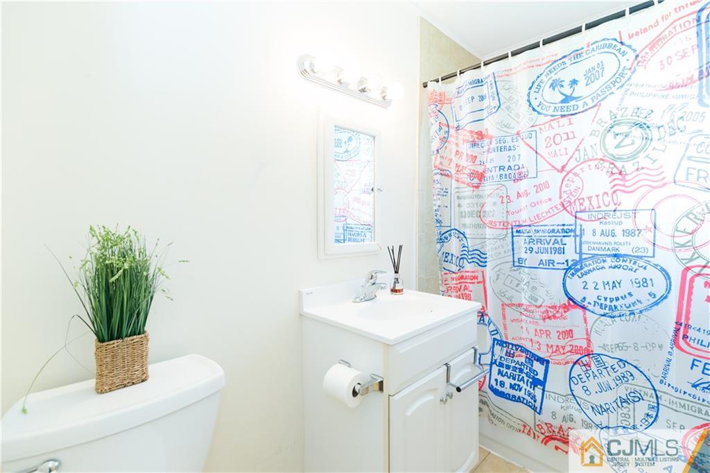 5 Mercury Road Edison, NJ 08817 - Photo 14 of 29 a bathroom with a sink and a mirror