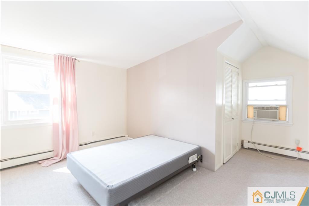 5 Mercury Road Edison, NJ 08817 - Photo 16 of 29 a bedroom with a bed and a window