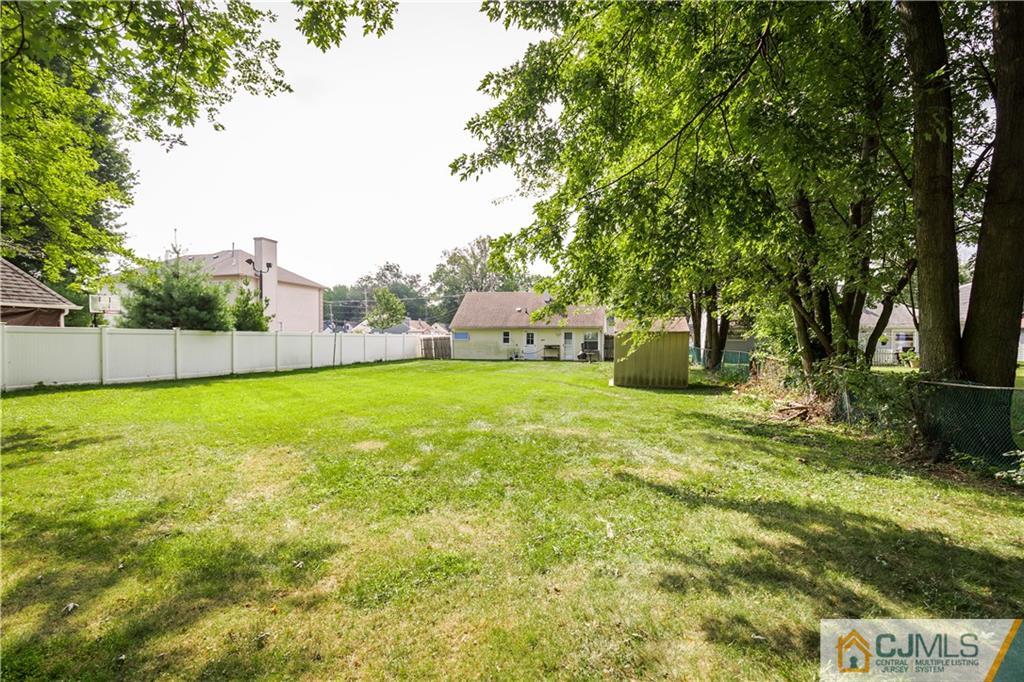 5 Mercury Road Edison, NJ 08817 - Photo 24 of 29 a view of a backyard with a small cabin