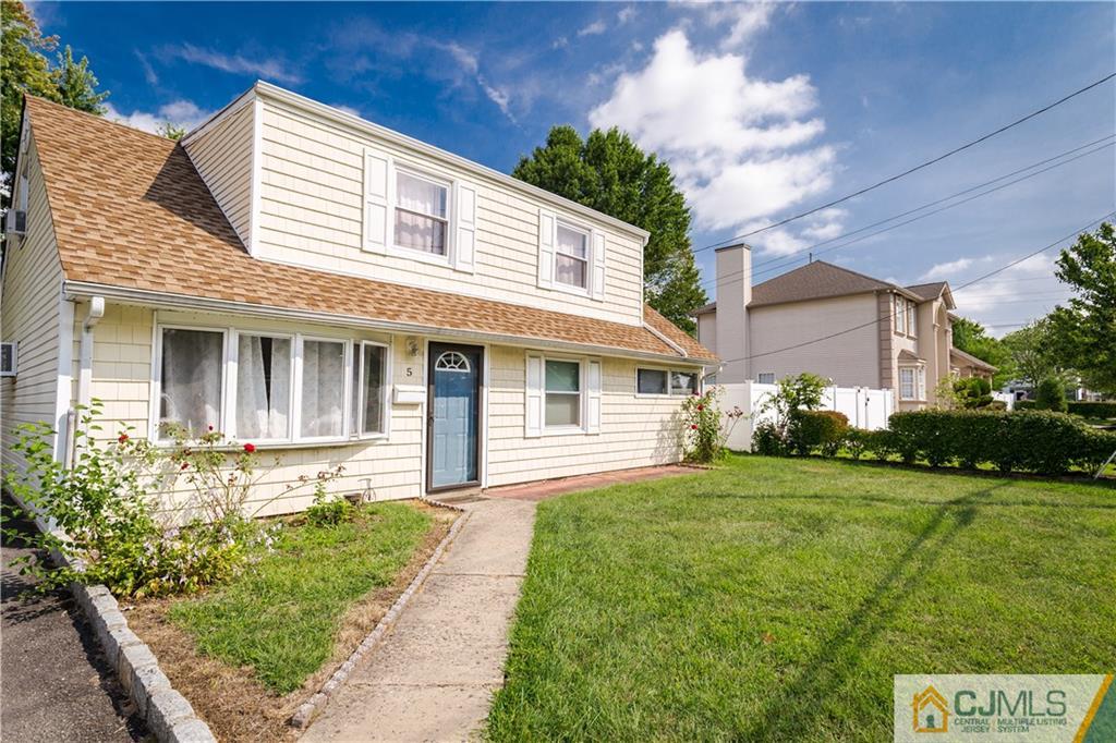 5 Mercury Road Edison, NJ 08817 - Photo 4 of 29 a front view of a house with a yard
