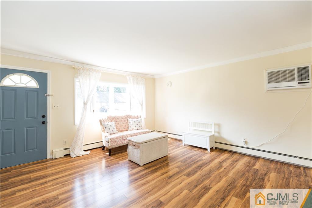 5 Mercury Road Edison, NJ 08817 - Photo 6 of 29 a living room with furniture and wooden floor