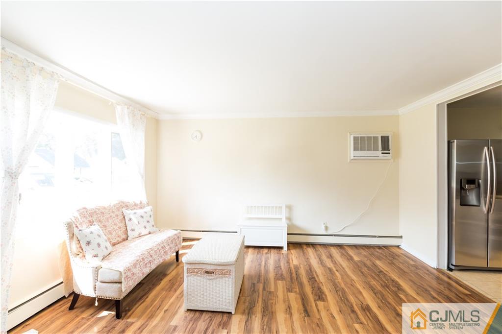 5 Mercury Road Edison, NJ 08817 - Photo 7 of 29 a living room with a couch and wooden floor