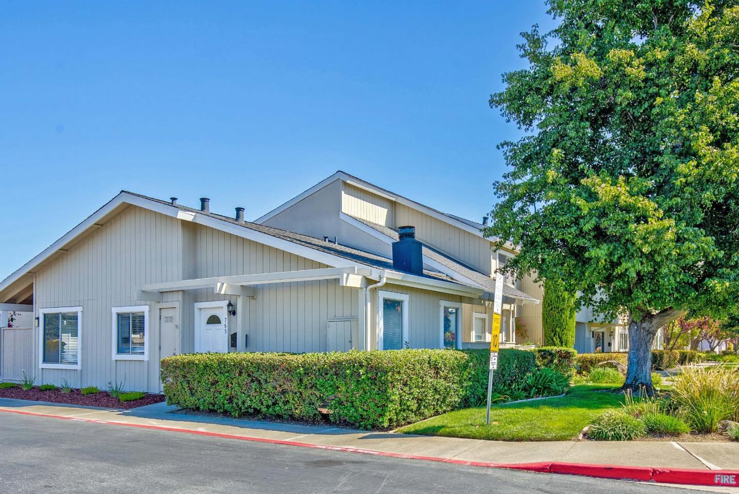 765 Comet Drive Foster City, CA 94404 - Photo 1 of 33 a front view of a house with a yard and garage