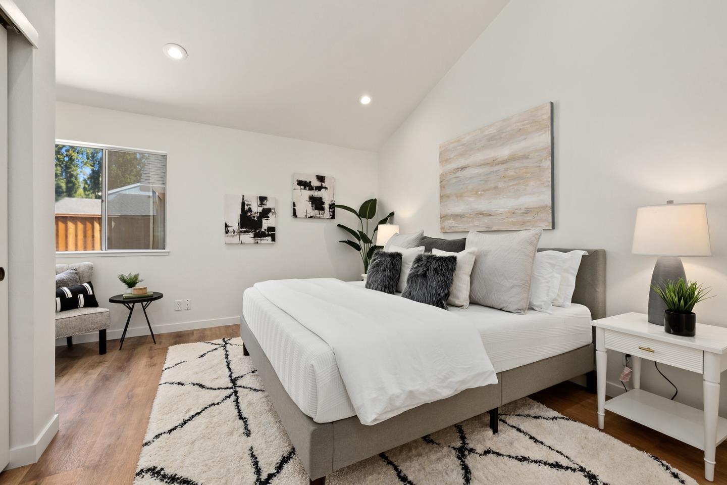 765 Comet Drive Foster City, CA 94404 - Photo 21 of 33 a bedroom with a large bed and potted plant on the dresser