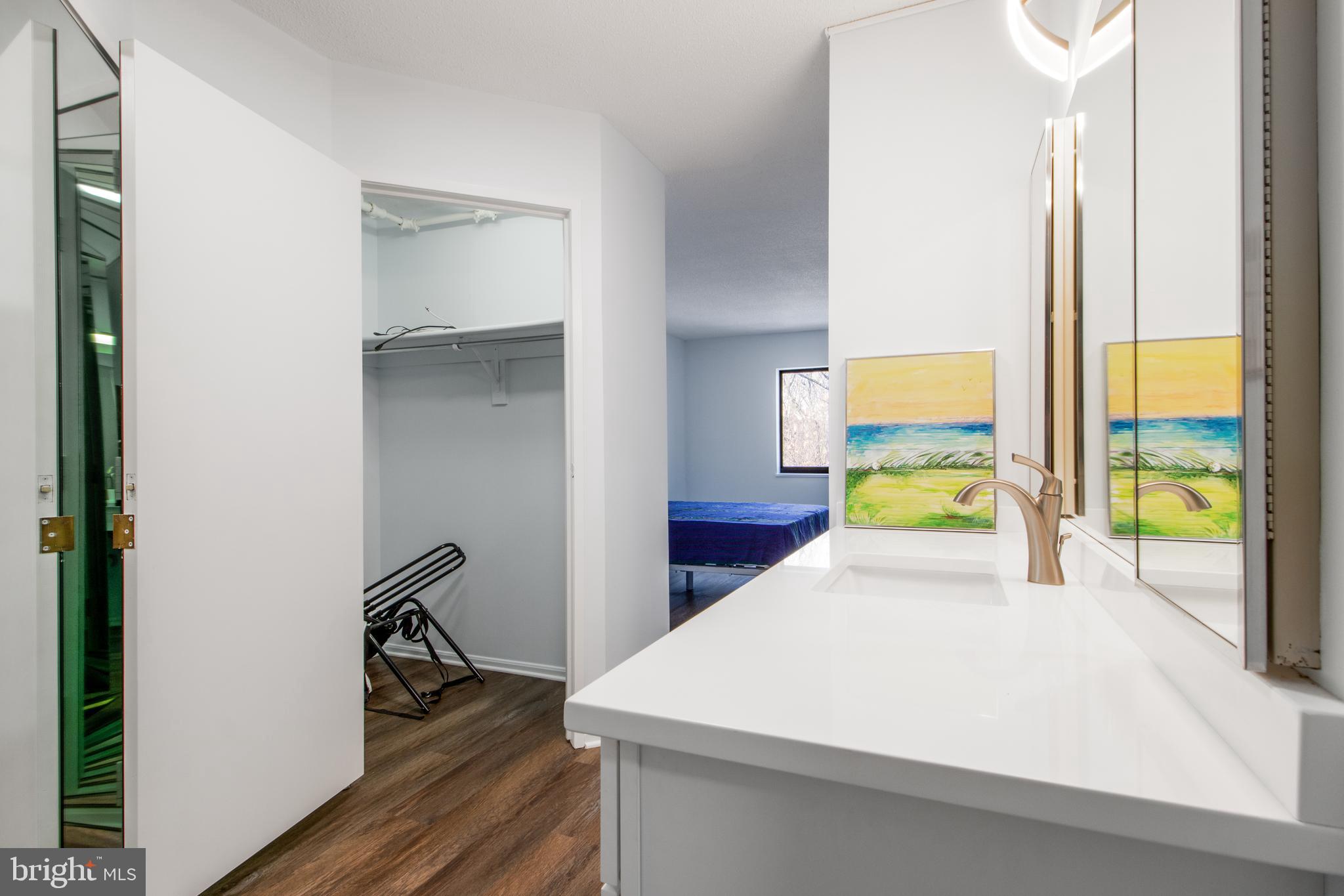 15115 Interlachen Drive, Unit 31020 Silver Spring, MD 20906 - Photo 28 of 48 a bed room with a bed and a window