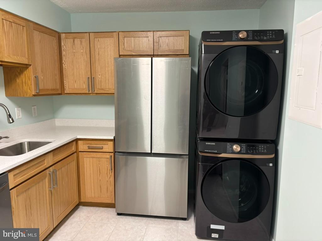 15115 Interlachen Drive, Unit 31020 Silver Spring, MD 20906 - Photo 10 of 48 a utility room with dryer and washer
