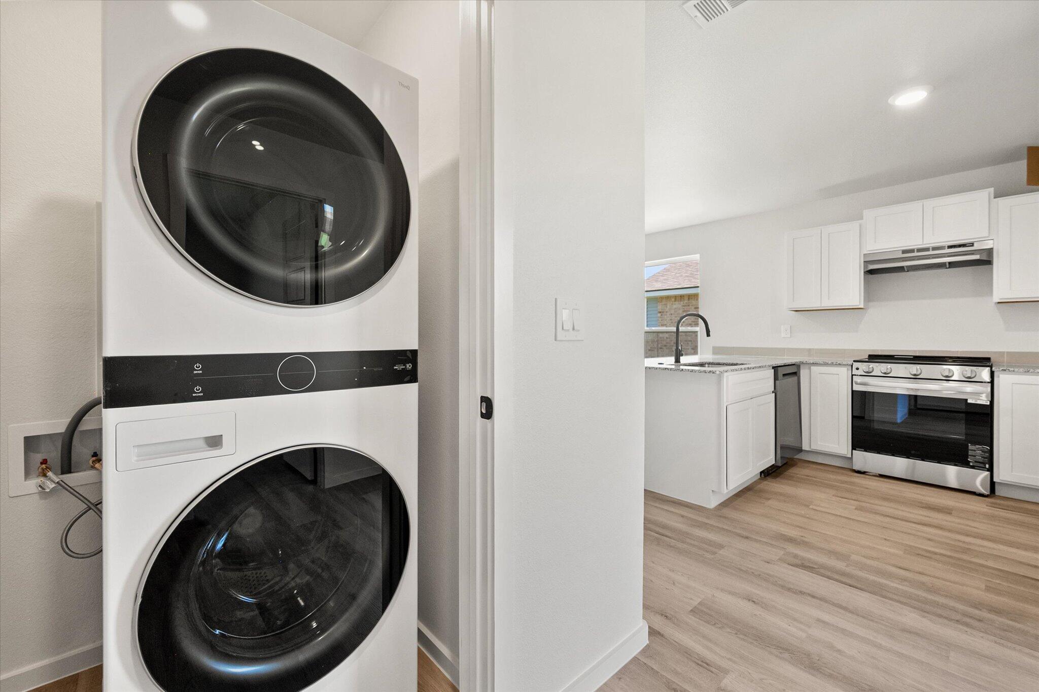 8312 25th Street Lubbock, TX 79407 - Photo 15 of 17 a view of a kitchen with washer and dryer
