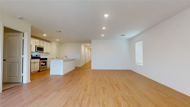 a view of kitchen with wooden floor