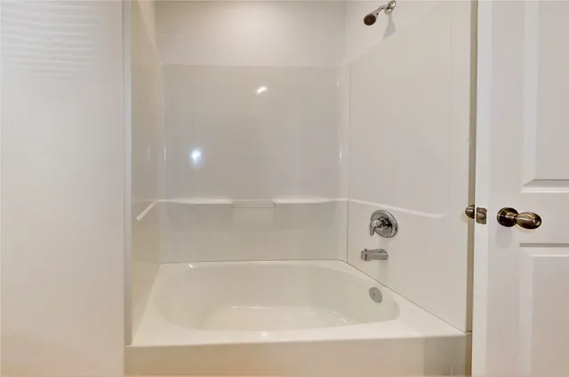 a close up of a bathtub in a bathroom