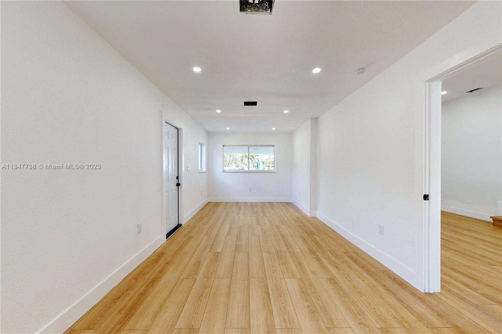 7950 Southwest 22nd Street Miami, FL 33155 - Photo 11 of 36 a view of hallway with wooden floor