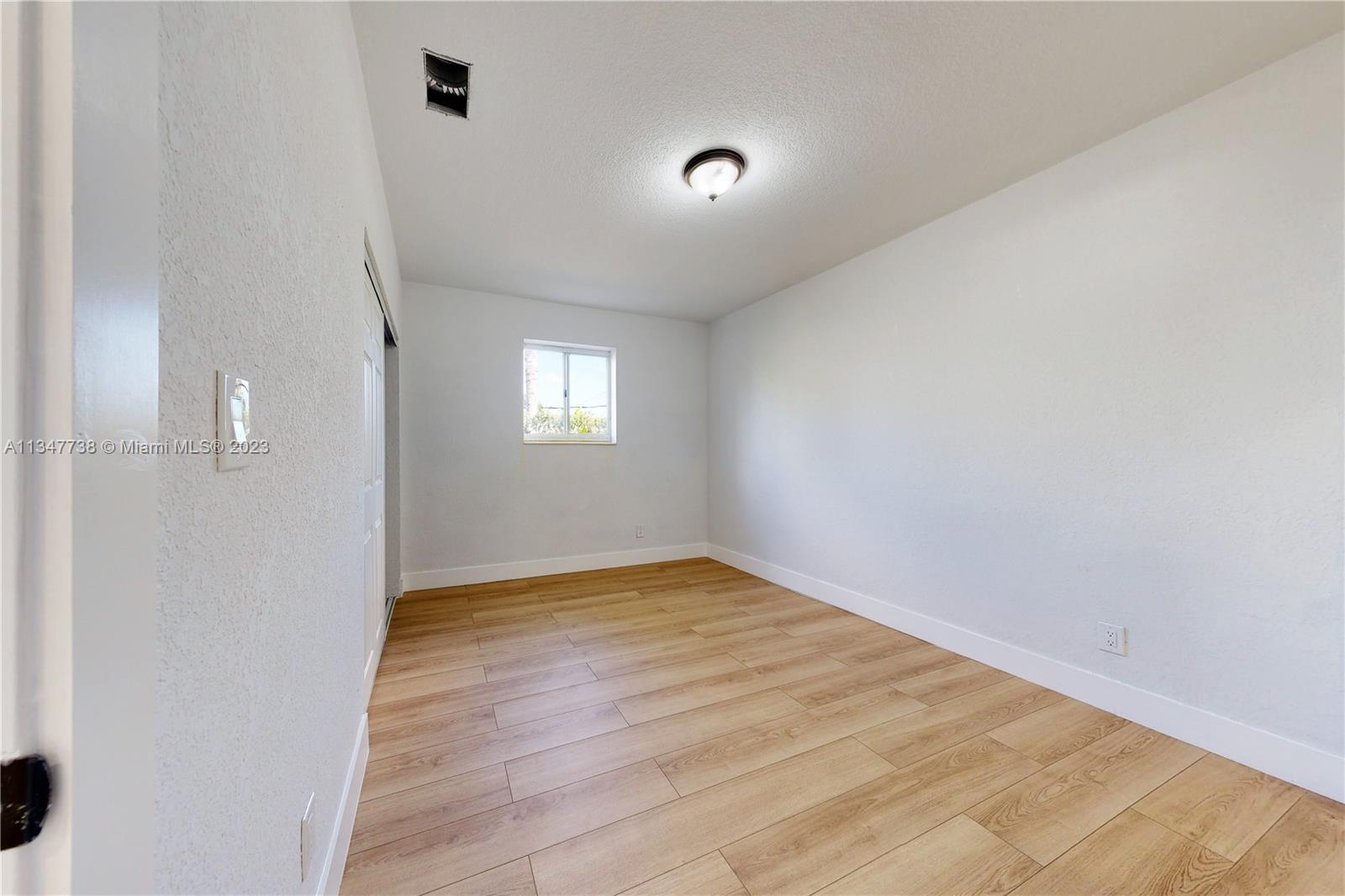 7950 Southwest 22nd Street Miami, FL 33155 - Photo 16 of 36 a view of an empty room and window