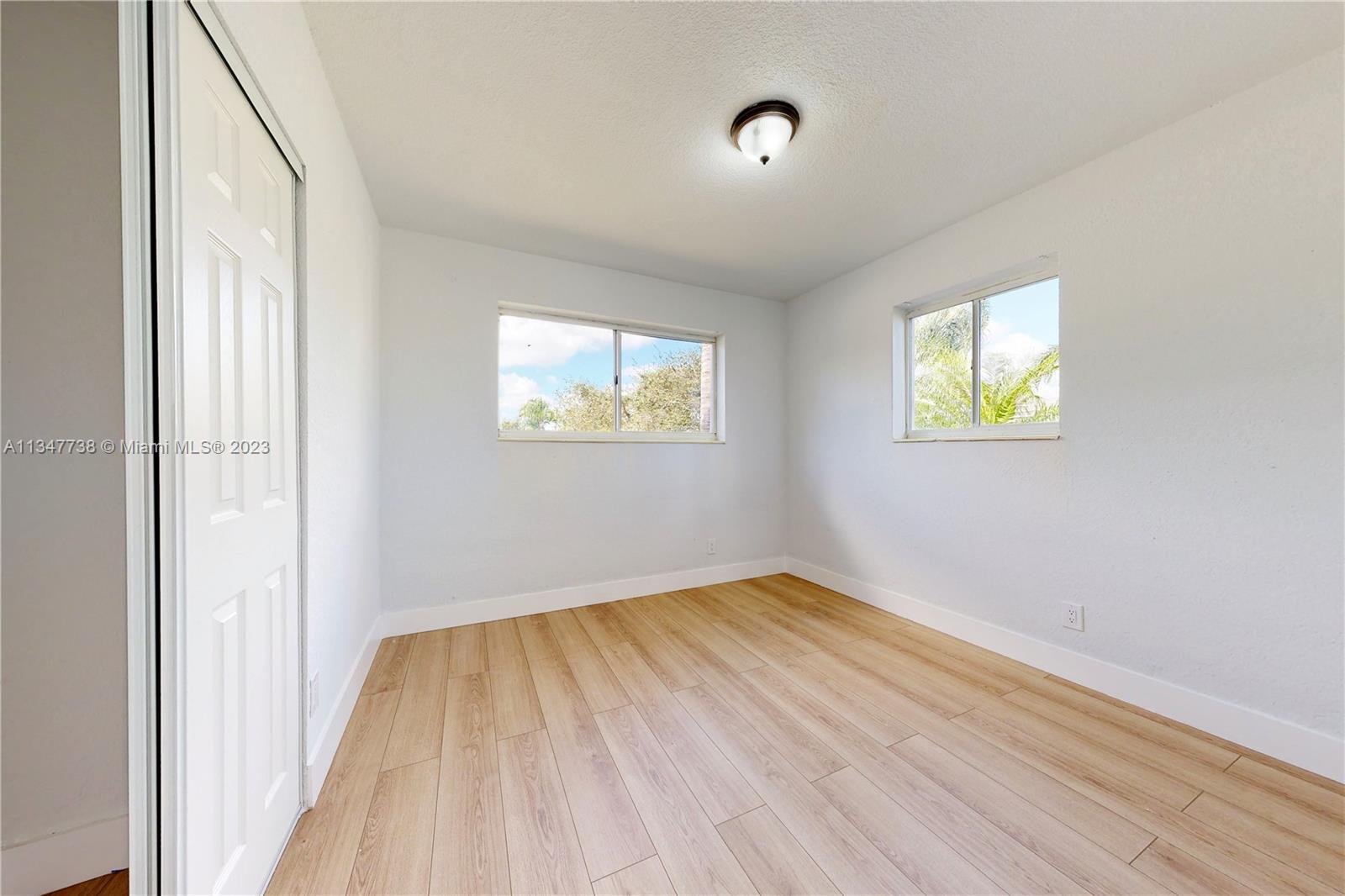 7950 Southwest 22nd Street Miami, FL 33155 - Photo 19 of 36 an empty room with windows