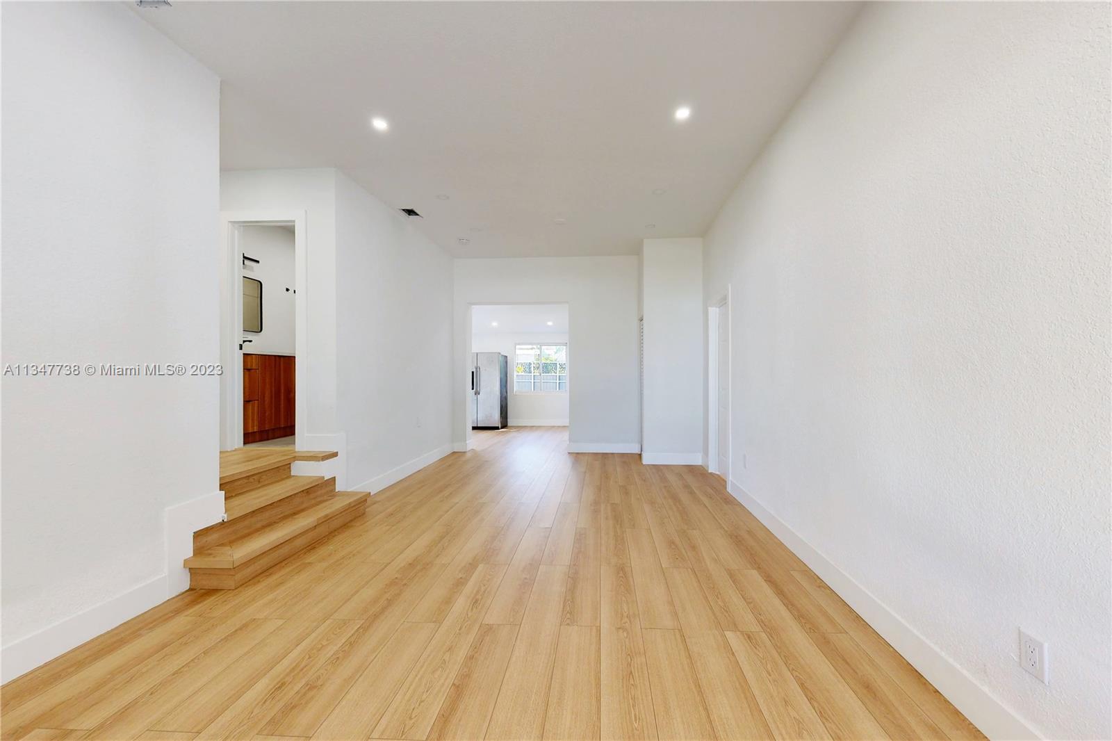 7950 Southwest 22nd Street Miami, FL 33155 - Photo 2 of 36 a view of empty room with wooden floor