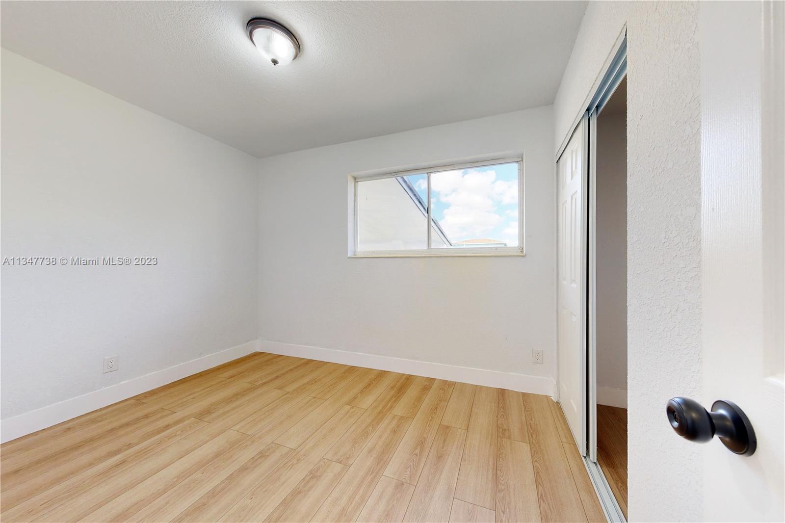 7950 Southwest 22nd Street Miami, FL 33155 - Photo 24 of 36 an empty room with a window