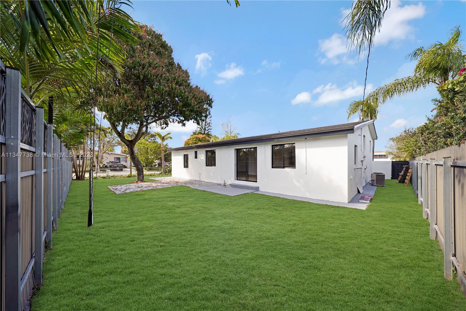 7950 Southwest 22nd Street Miami, FL 33155 - Photo 30 of 36 a view of a backyard of the house