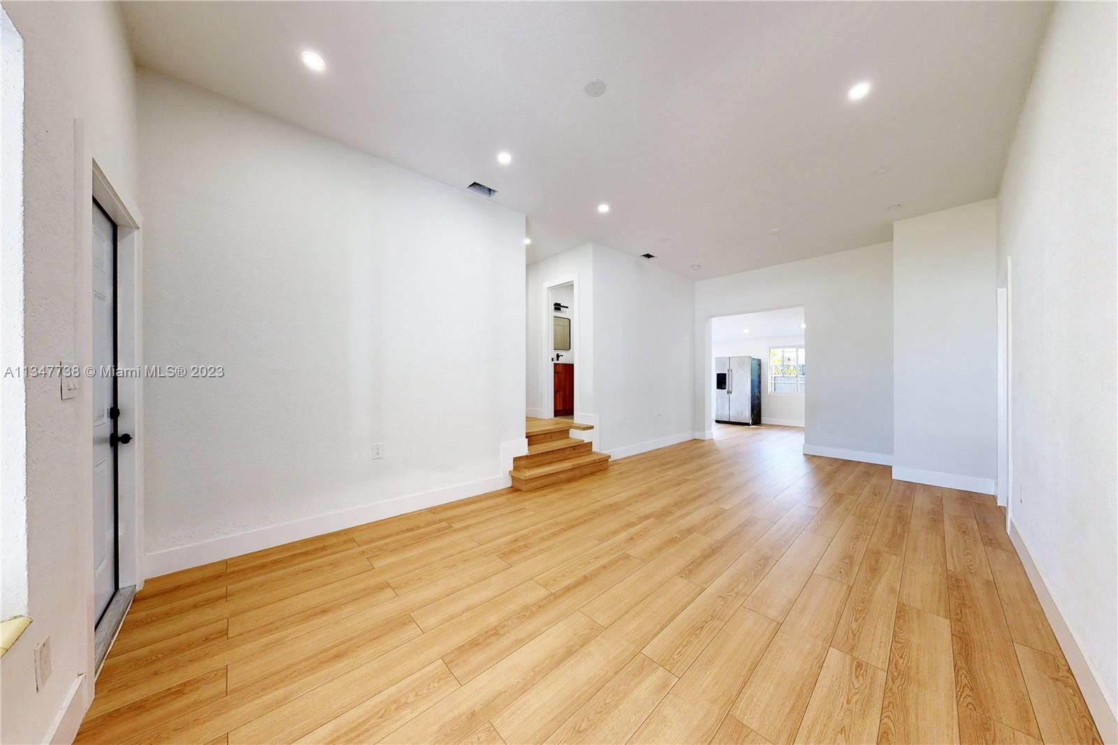 7950 Southwest 22nd Street Miami, FL 33155 - Photo 3 of 36 a view of empty room with wooden floor