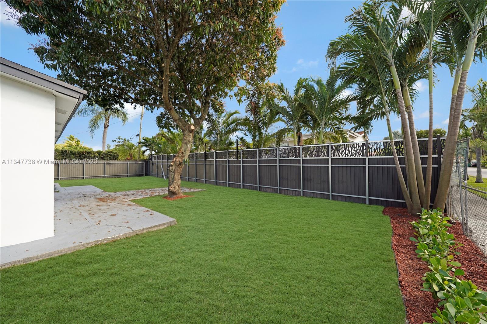 7950 Southwest 22nd Street Miami, FL 33155 - Photo 34 of 36 a view of a backyard with a tree