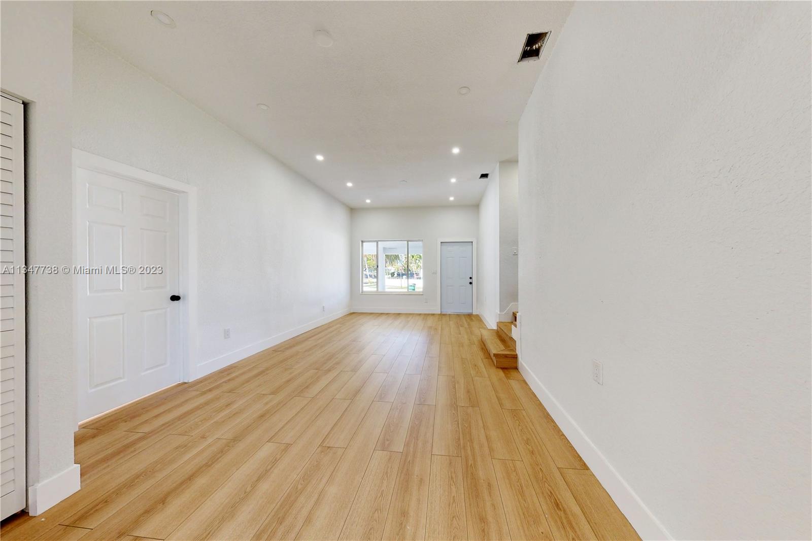 7950 Southwest 22nd Street Miami, FL 33155 - Photo 4 of 36 a view of gallery with wooden floor