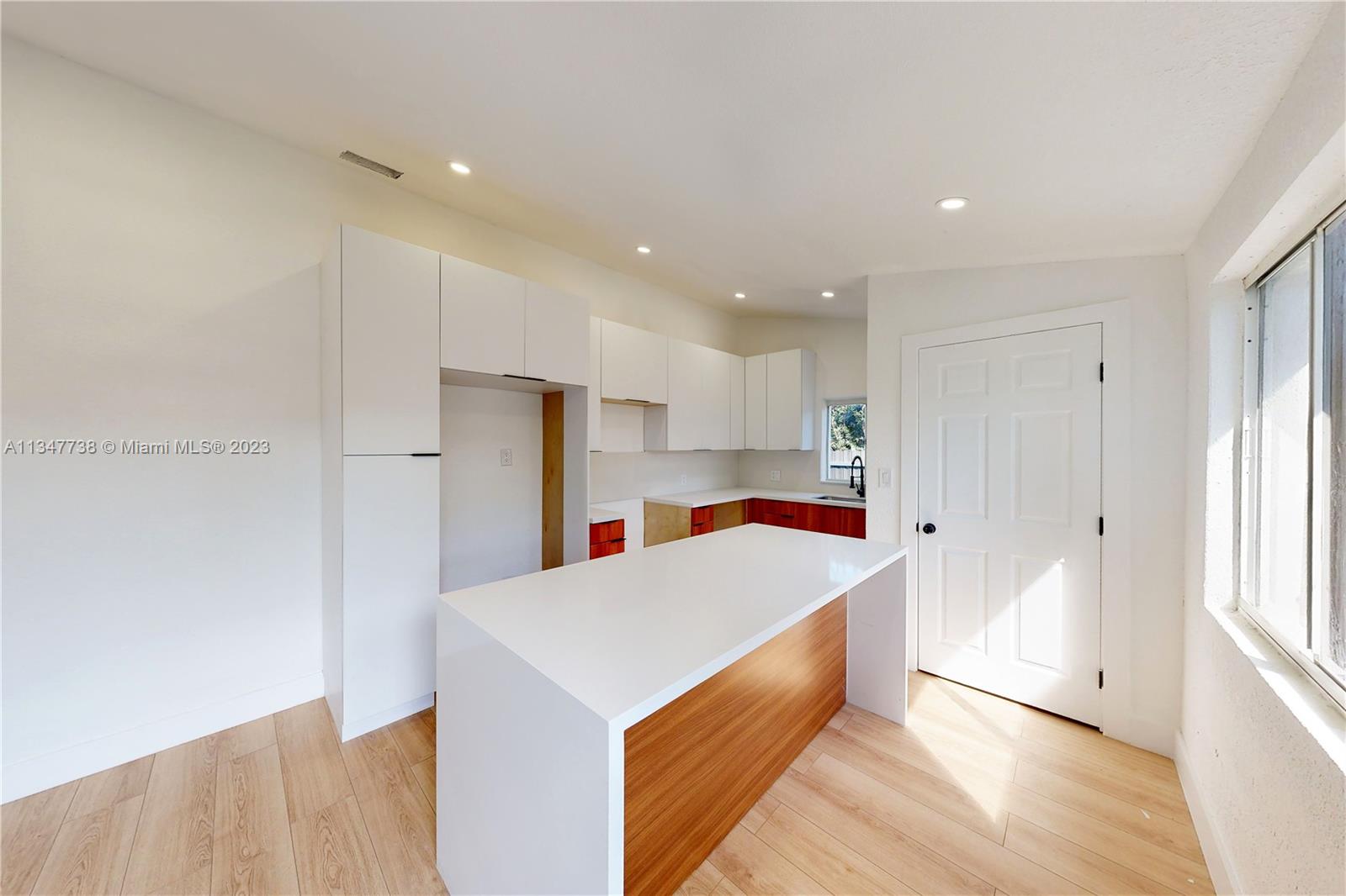 7950 Southwest 22nd Street Miami, FL 33155 - Photo 8 of 36 a view of kitchen with wooden floor