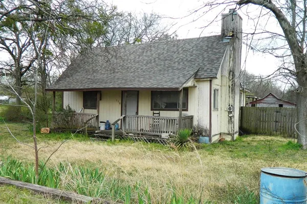 a backyard of a house with seating space