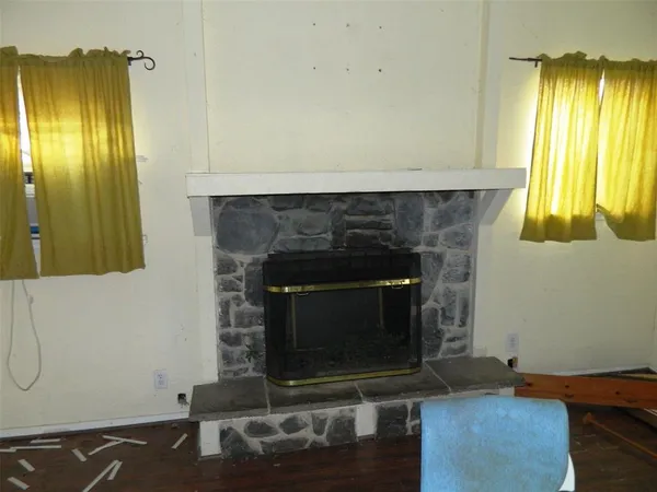 a living room with a fireplace