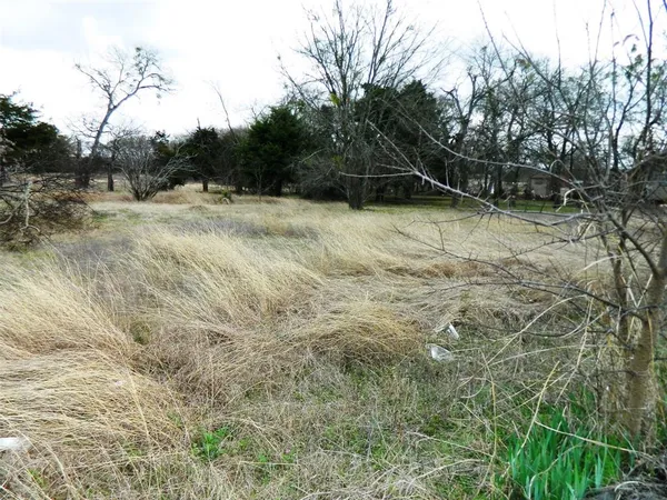 a view of a room with a window and chandelier