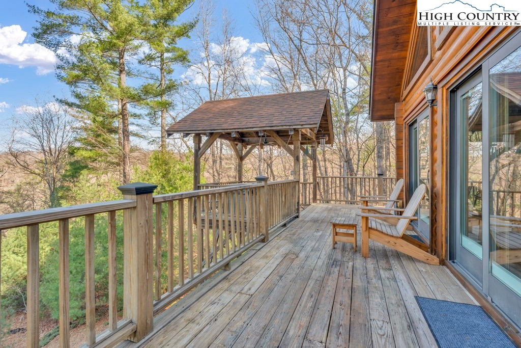 801 Wagon Ridge Road Ferguson, NC 28624 - Photo 13 of 44 a view of balcony with furniture and wooden floor
