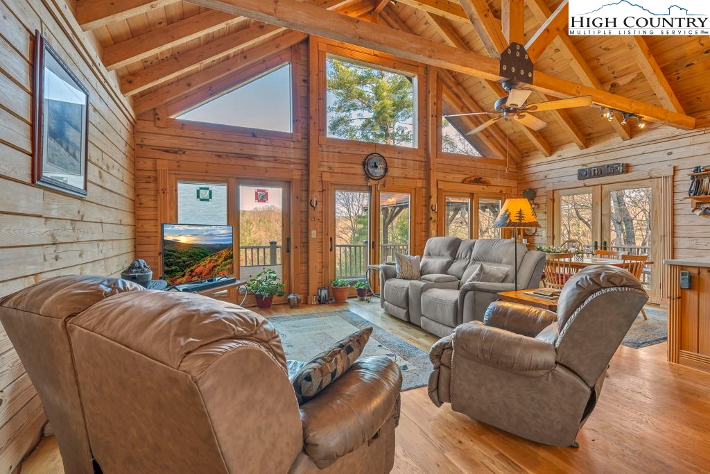 801 Wagon Ridge Road Ferguson, NC 28624 - Photo 15 of 44 a bed room with a bed and a couch