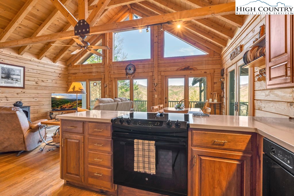 801 Wagon Ridge Road Ferguson, NC 28624 - Photo 21 of 44 a kitchen with a stove a sink and cabinets