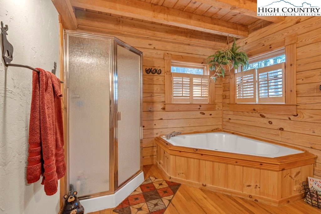 801 Wagon Ridge Road Ferguson, NC 28624 - Photo 24 of 44 a bathroom with a tub sink and shower
