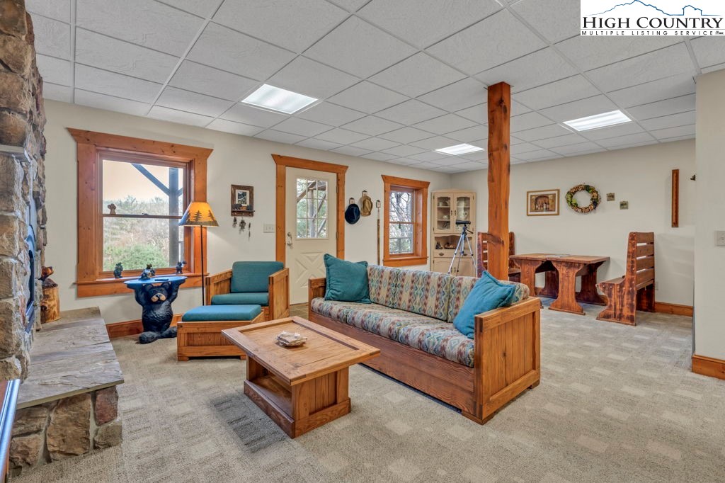 801 Wagon Ridge Road Ferguson, NC 28624 - Photo 35 of 44 a living room with furniture and a large window