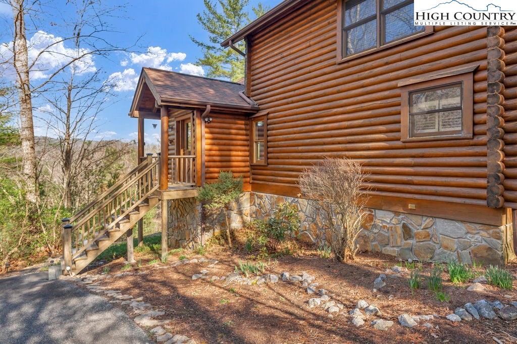 801 Wagon Ridge Road Ferguson, NC 28624 - Photo 4 of 44 a brick house with a large tree