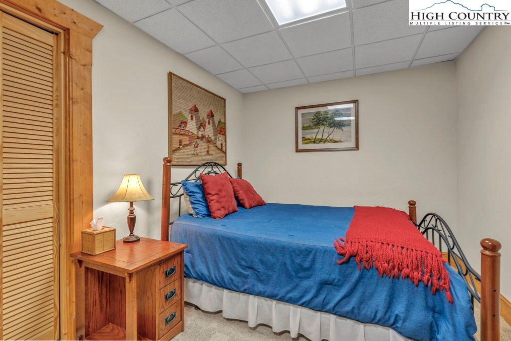 801 Wagon Ridge Road Ferguson, NC 28624 - Photo 41 of 44 a bedroom with a bed and window