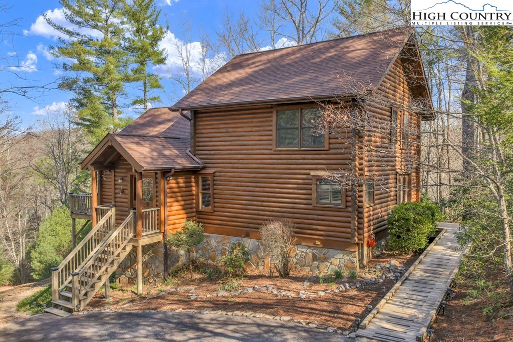 801 Wagon Ridge Road Ferguson, NC 28624 - Photo 5 of 44 a view of a house with a yard