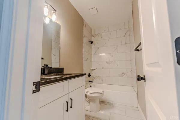 a view of wooden floor and windows in a room
